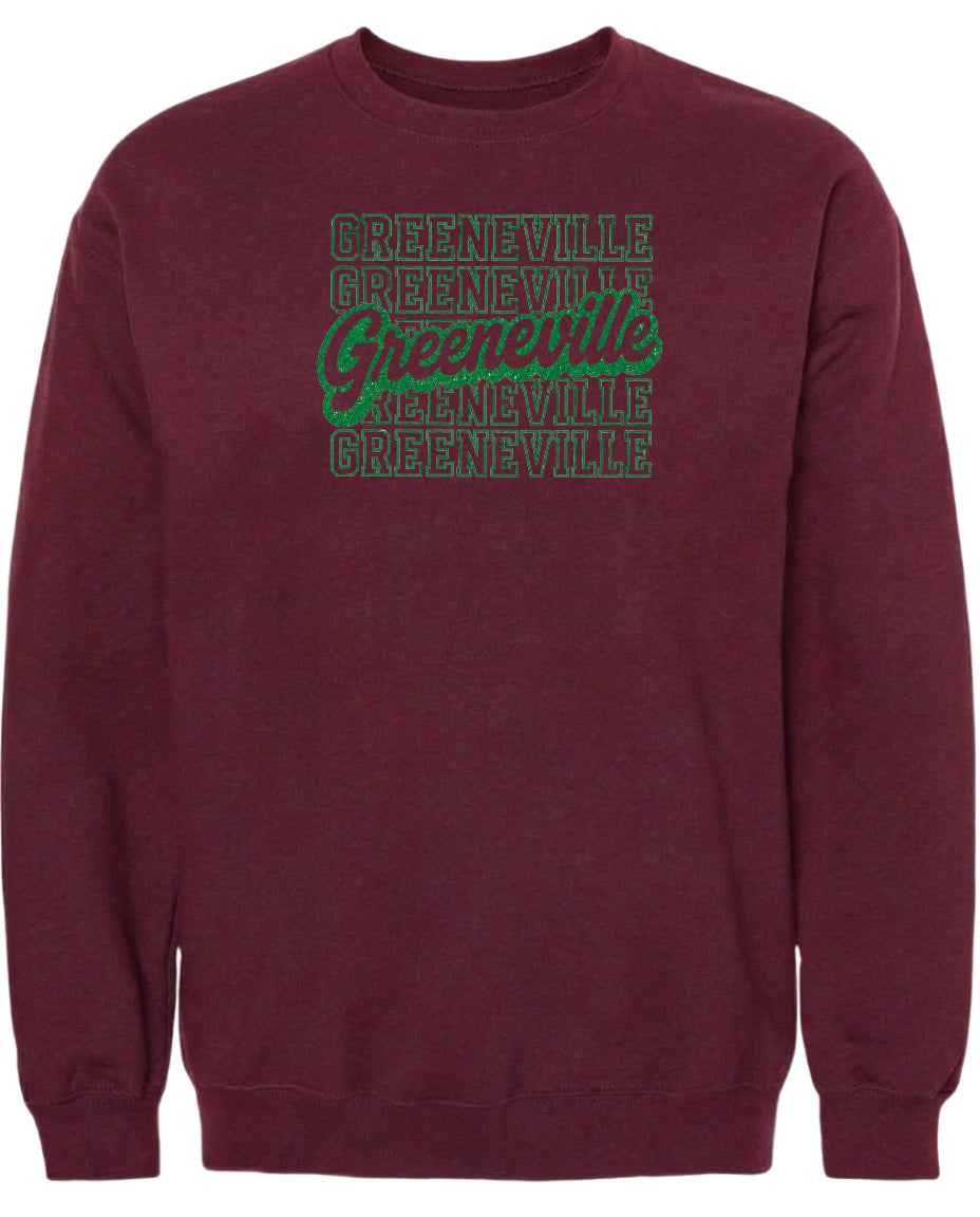 A burgundy sweatshirt with the text "Greeneville Greeneville Greeneville" printed in green on the front.