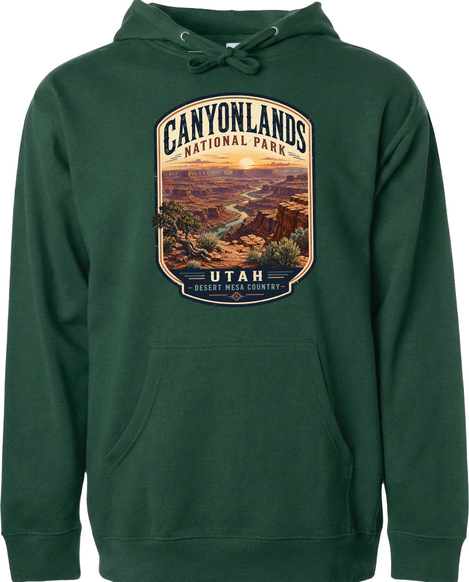A green hoodie with a graphic design depicting the scenic landscape of Canyonlands National Park in Utah.