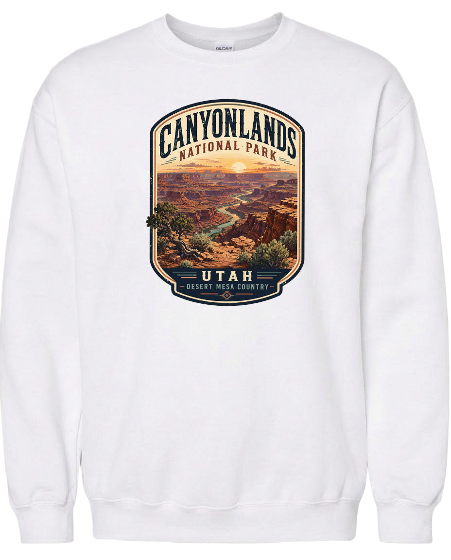 A white sweatshirt with a graphic design depicting the scenic landscape of Canyonlands National Park in Utah.
