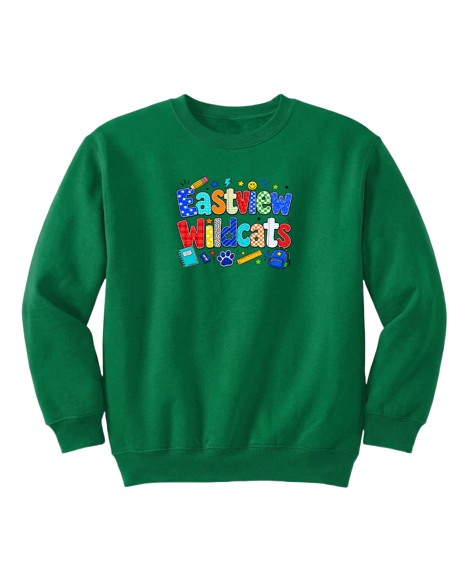 A bright green sweatshirt with a colorful graphic design featuring the text "Eastview Wildcats" and various school supplies.