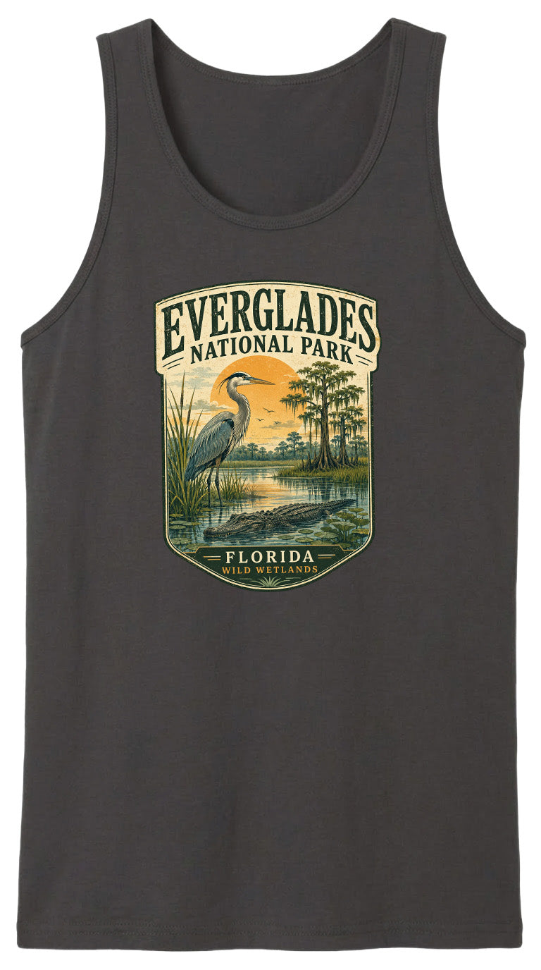 A black tank top with a graphic design depicting a bird standing in a marshy area with trees and a sunset in the background.