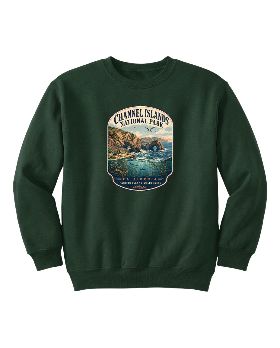 A green sweatshirt with a graphic design depicting a scenic coastal landscape, including cliffs, water, and a sunset.