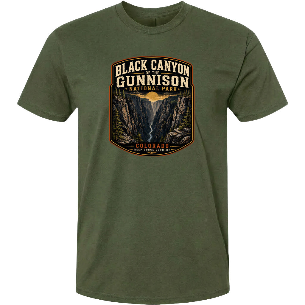 A green t-shirt with a graphic design depicting the Black Canyon of the Gunnison National Park in Colorado.