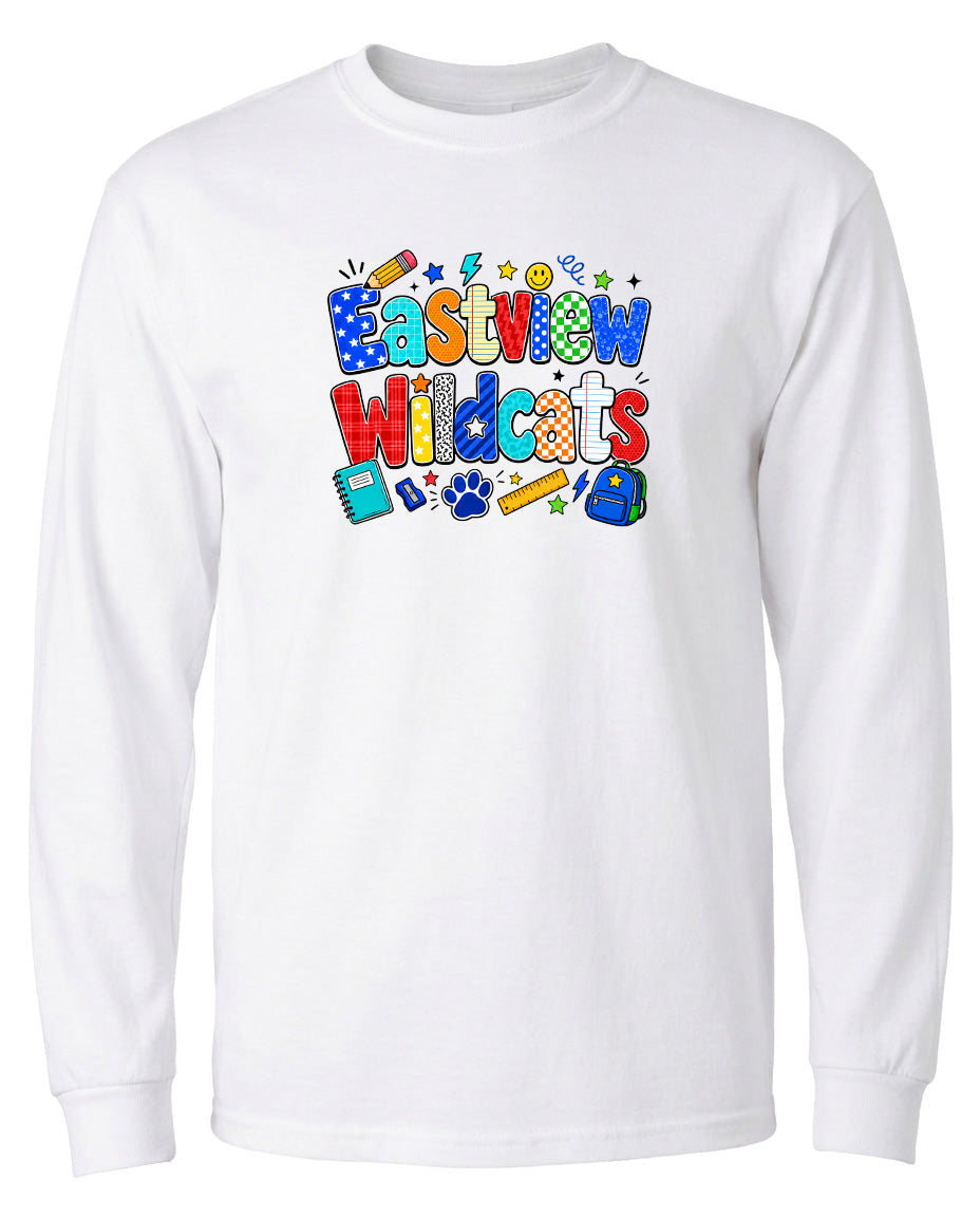 A white long-sleeved t-shirt with a colorful graphic design featuring the text "Eastview Wildcats" surrounded by various school-related icons and objects.