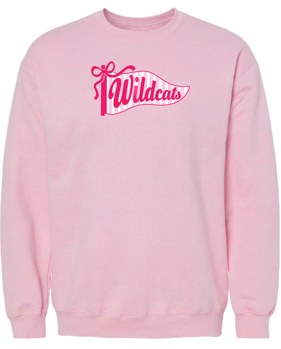 A pink sweatshirt with a graphic design featuring the word "Wildcats" in pink and white colors.