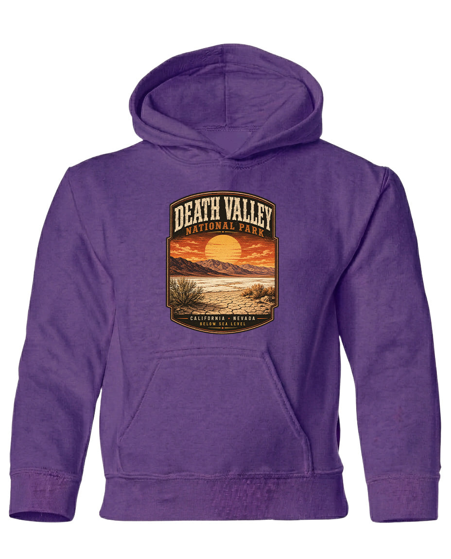 A purple hoodie with a graphic design depicting Death Valley National Park and a sunset landscape.