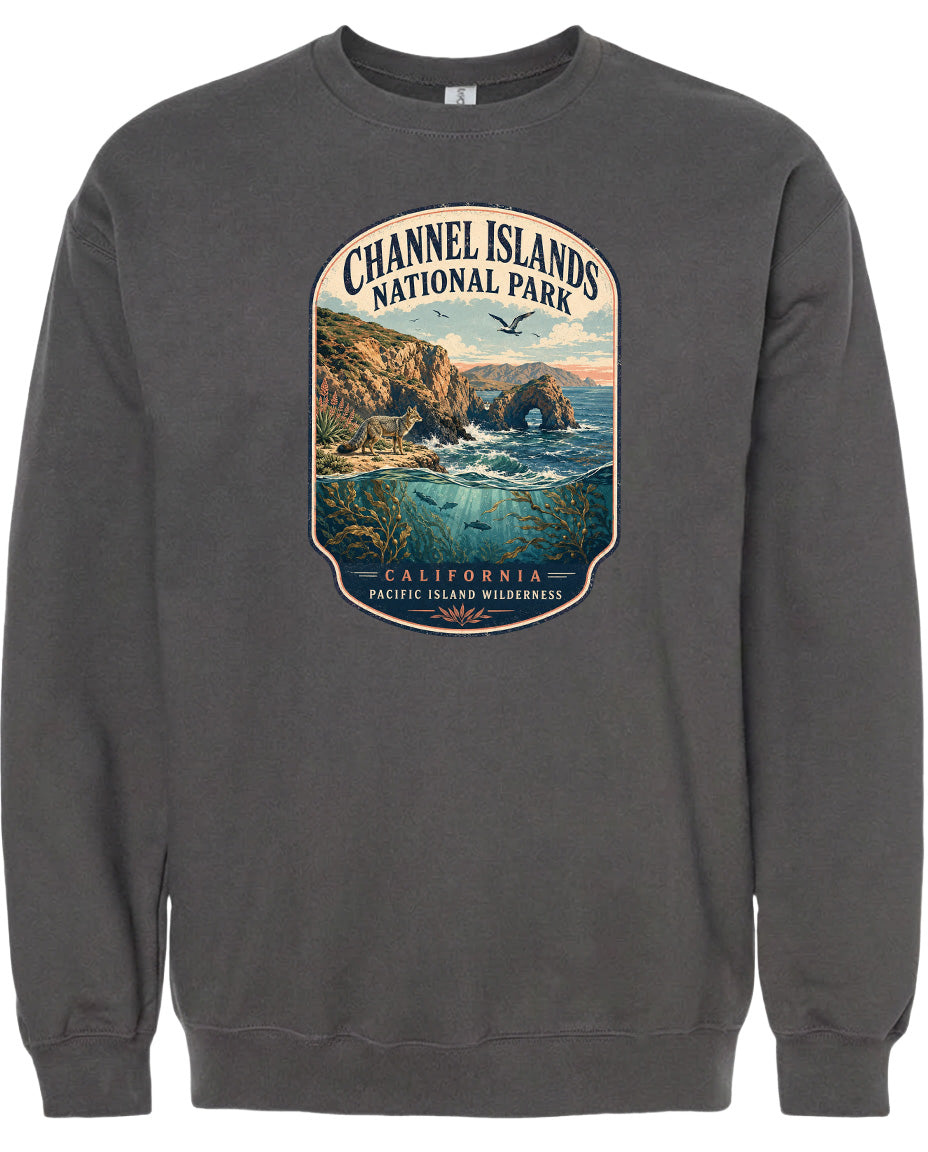 A gray sweatshirt with a graphic design depicting a scenic landscape with cliffs, water, and birds.
