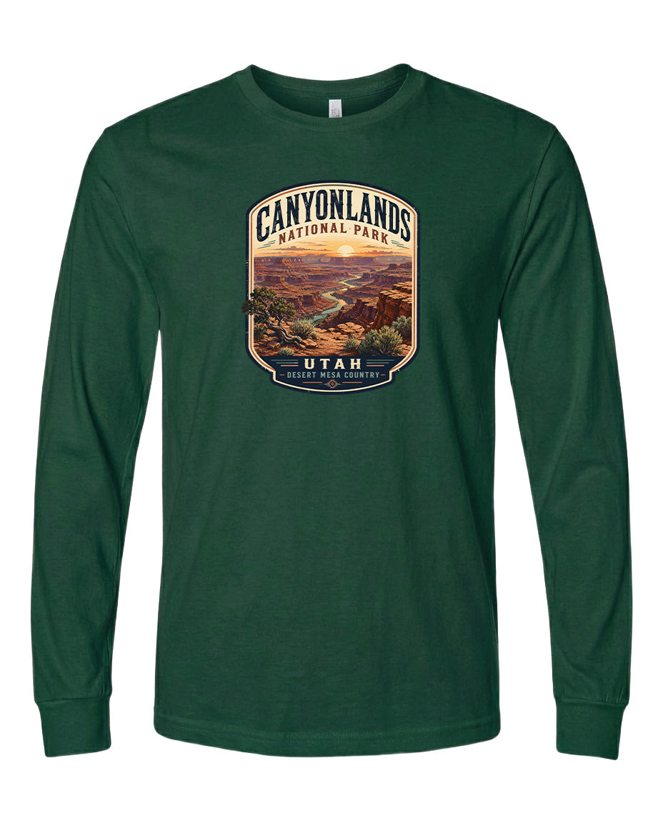 A long-sleeved green t-shirt with a graphic design depicting the scenic landscape of Canyonlands National Park in Utah.