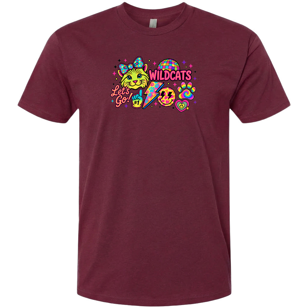 A burgundy-colored t-shirt with a colorful graphic design featuring a cat, a rainbow, and various other elements.