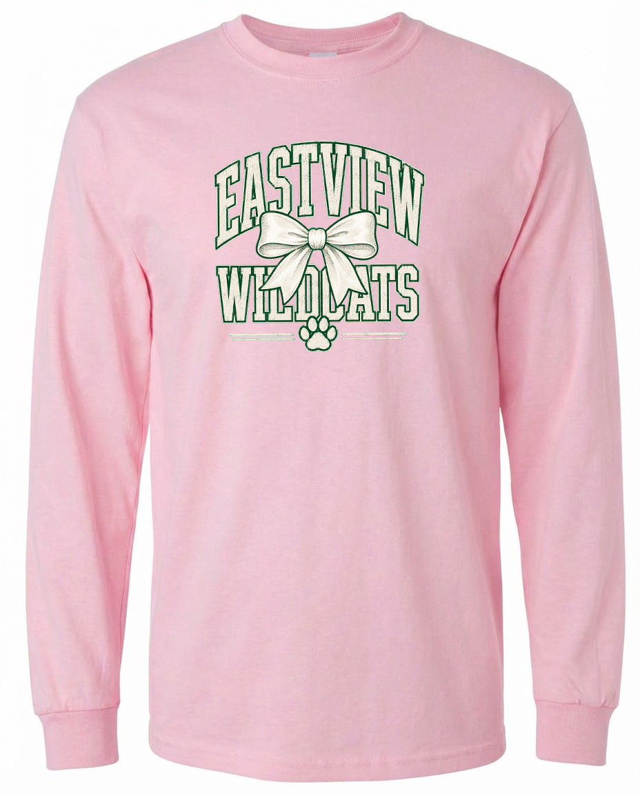 A pink long-sleeved t-shirt with a graphic design featuring the text "EASTVIEW WILDCATS" and a bow.