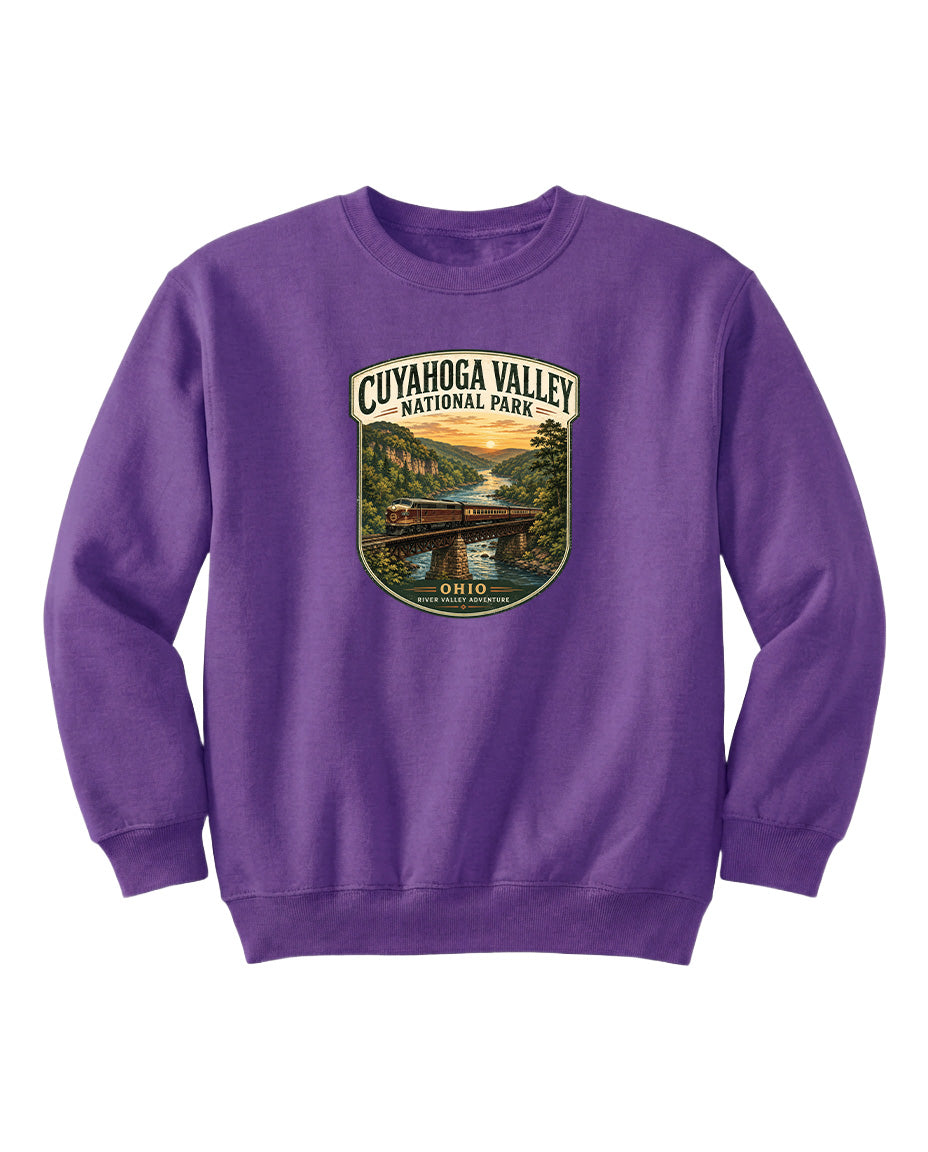 A purple sweatshirt with a graphic design depicting a scenic view of the Cuyahoga Valley National Park in Ohio.