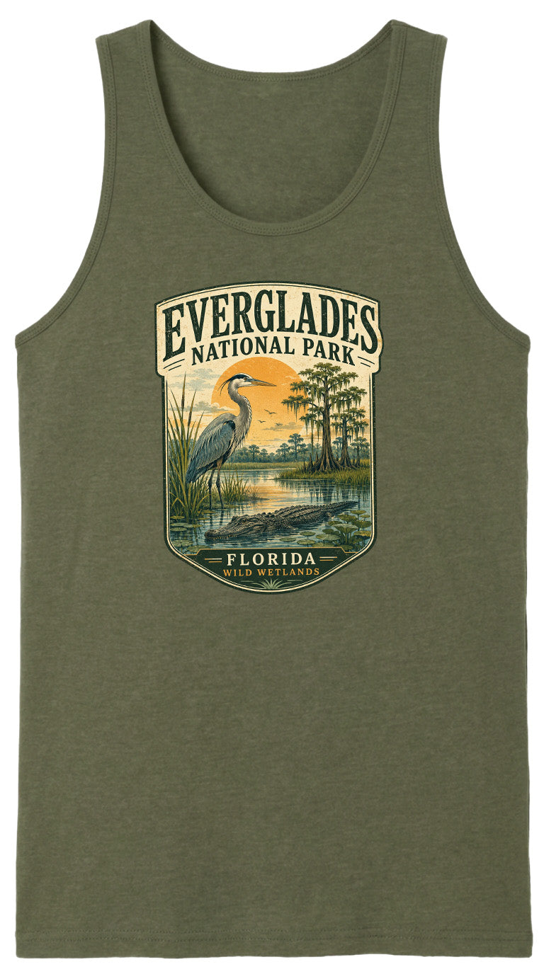 A green tank top with a graphic design depicting a bird standing in a marshy area with a sunset in the background.