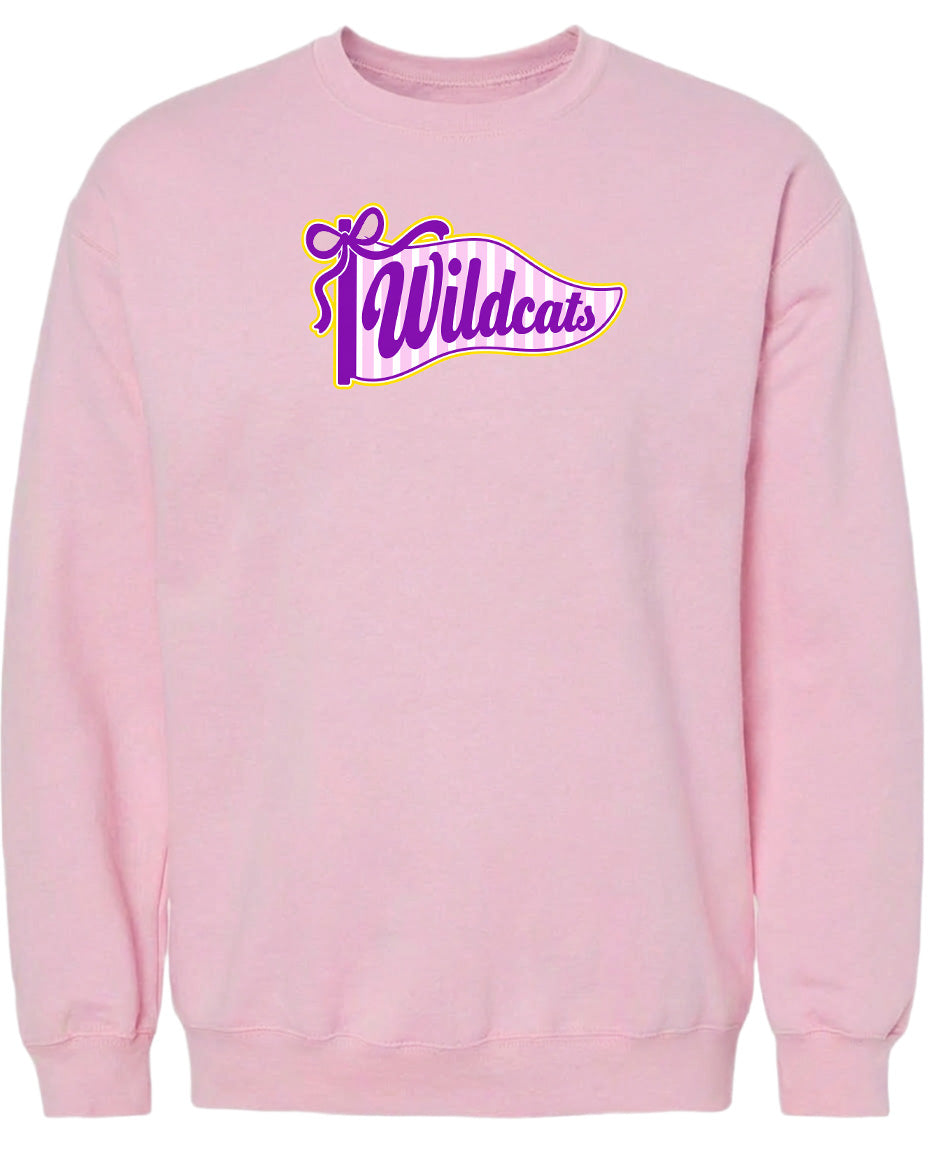 A pink sweatshirt with a purple and yellow graphic design featuring the word "Wildcats" on it.