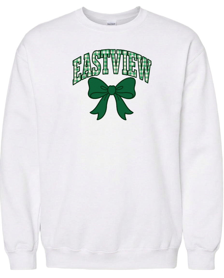 A white sweatshirt with a green bow and the word "EASTVIEW" printed on it.