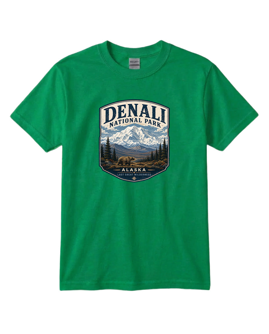 A green t-shirt with a graphic design depicting a mountain landscape and bears, representing Denali National Park in Alaska.