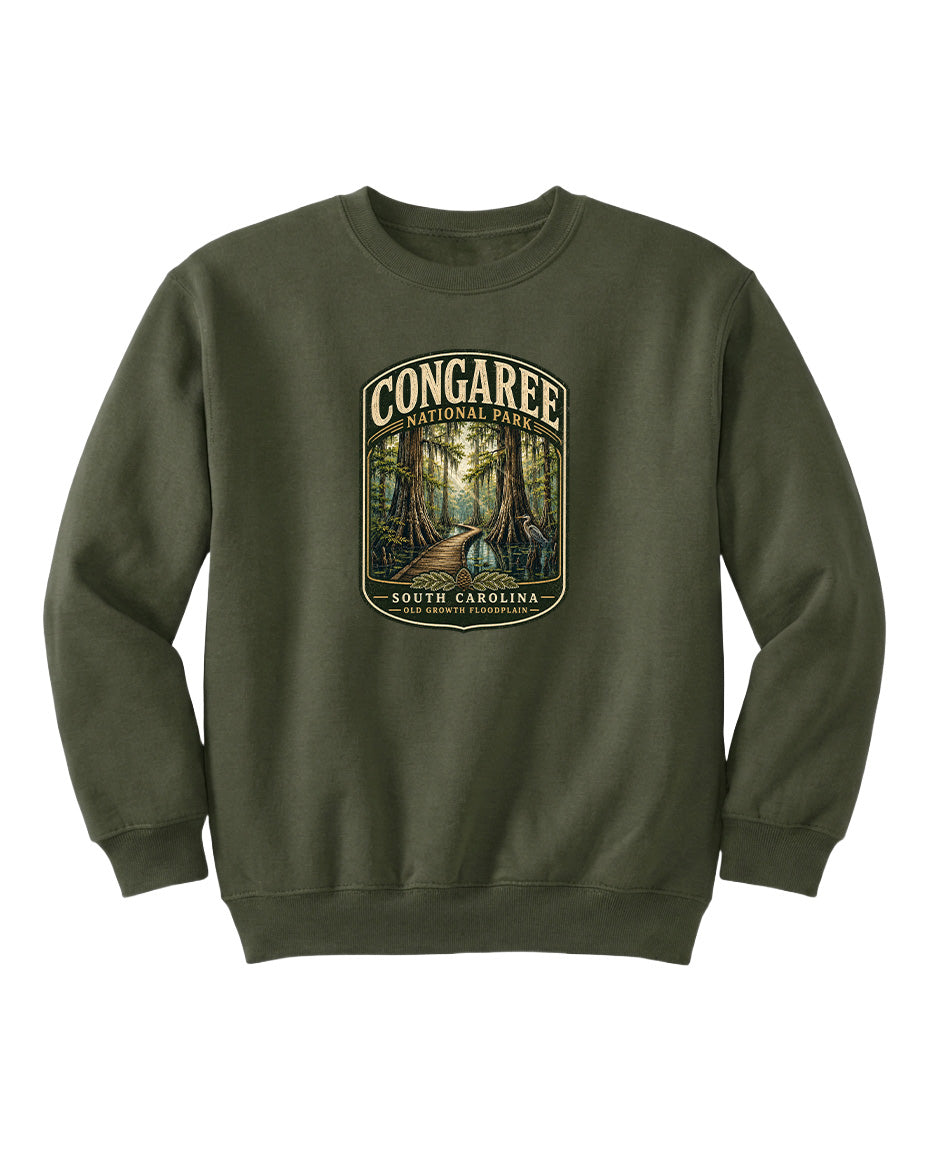 A green sweatshirt with a graphic design depicting a forest scene, featuring the text "CONGAREE NATIONAL PARK SOUTH CAROLINA" prominently displayed.