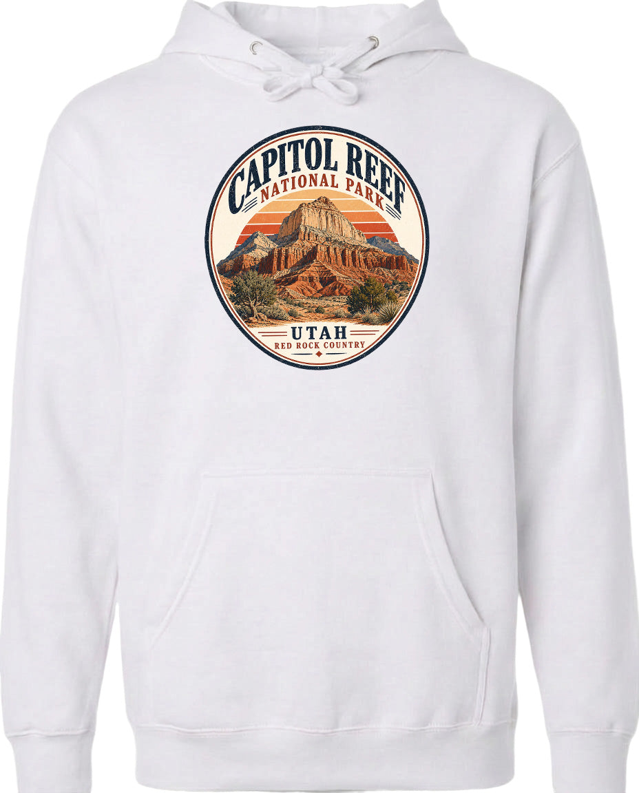 A white hoodie with a circular design featuring the Capitol Reef National Park in Utah.