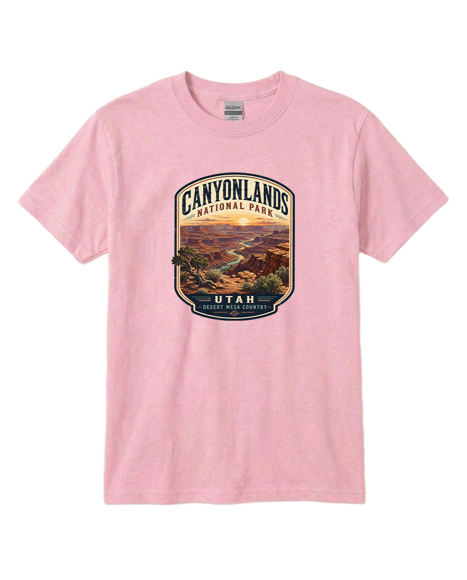 A pink t-shirt with a graphic design depicting a scenic landscape, specifically the Canyonlands National Park in Utah.