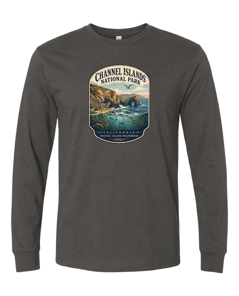 A gray long-sleeved t-shirt with a graphic design depicting a scenic coastal landscape, including cliffs, water, and a sunset.