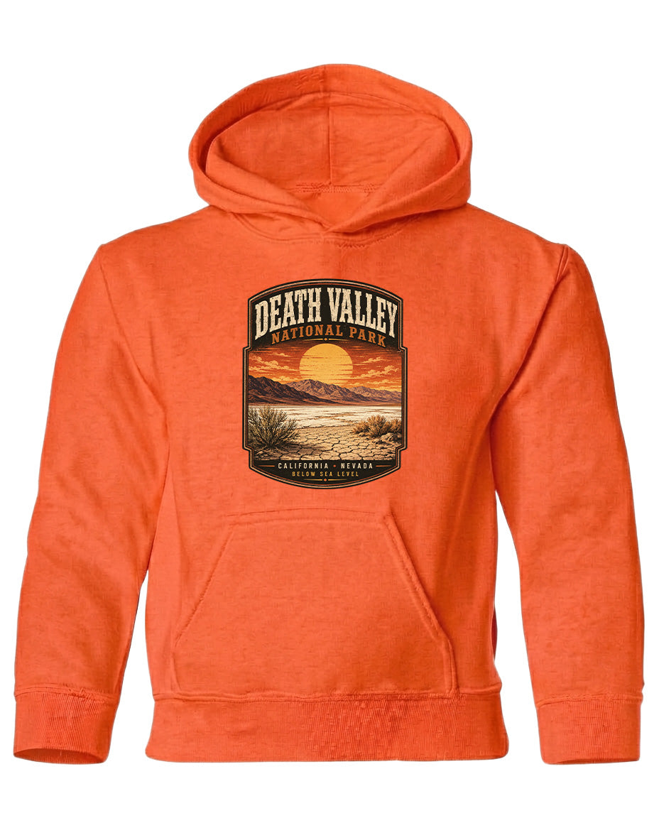 An orange hoodie with a graphic design depicting Death Valley National Park and a sunset landscape.