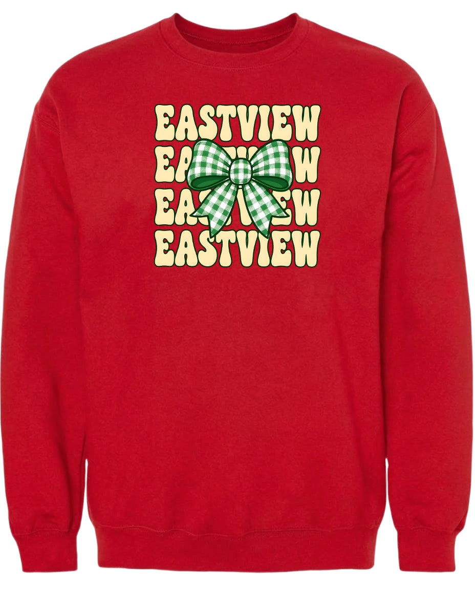 A red sweatshirt with a graphic design featuring a green and white checkered bow and the text "EASTVIEW" repeated in a vertical pattern.