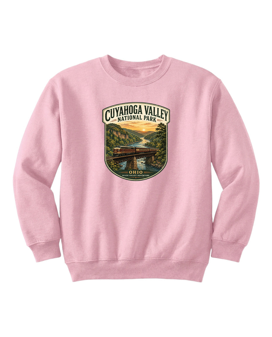 A pink sweatshirt with a graphic design depicting a scenic view of the Cuyahoga Valley National Park in Ohio.