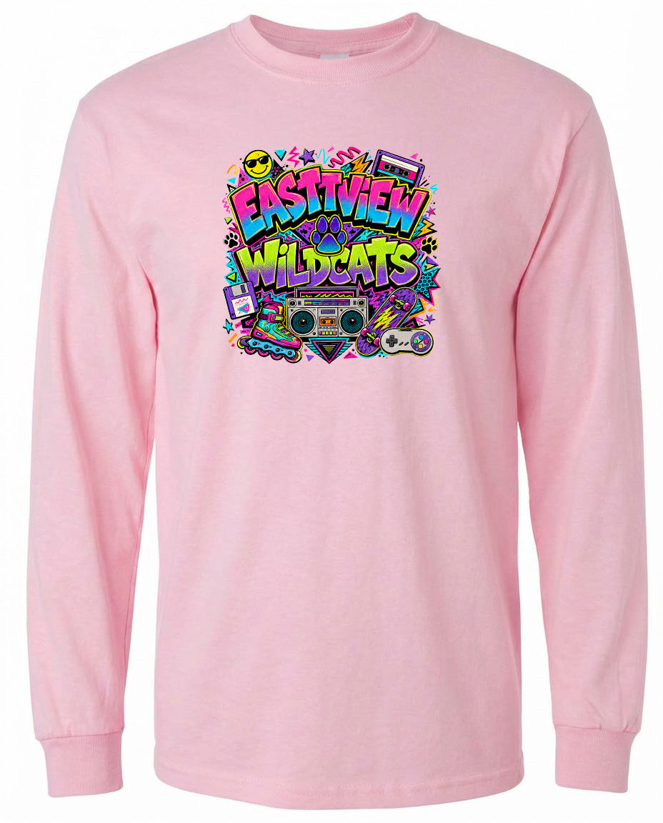 A pink long-sleeved t-shirt with a colorful graphic design featuring the text "EASTVIEW WILDCATS" surrounded by various icons and symbols.