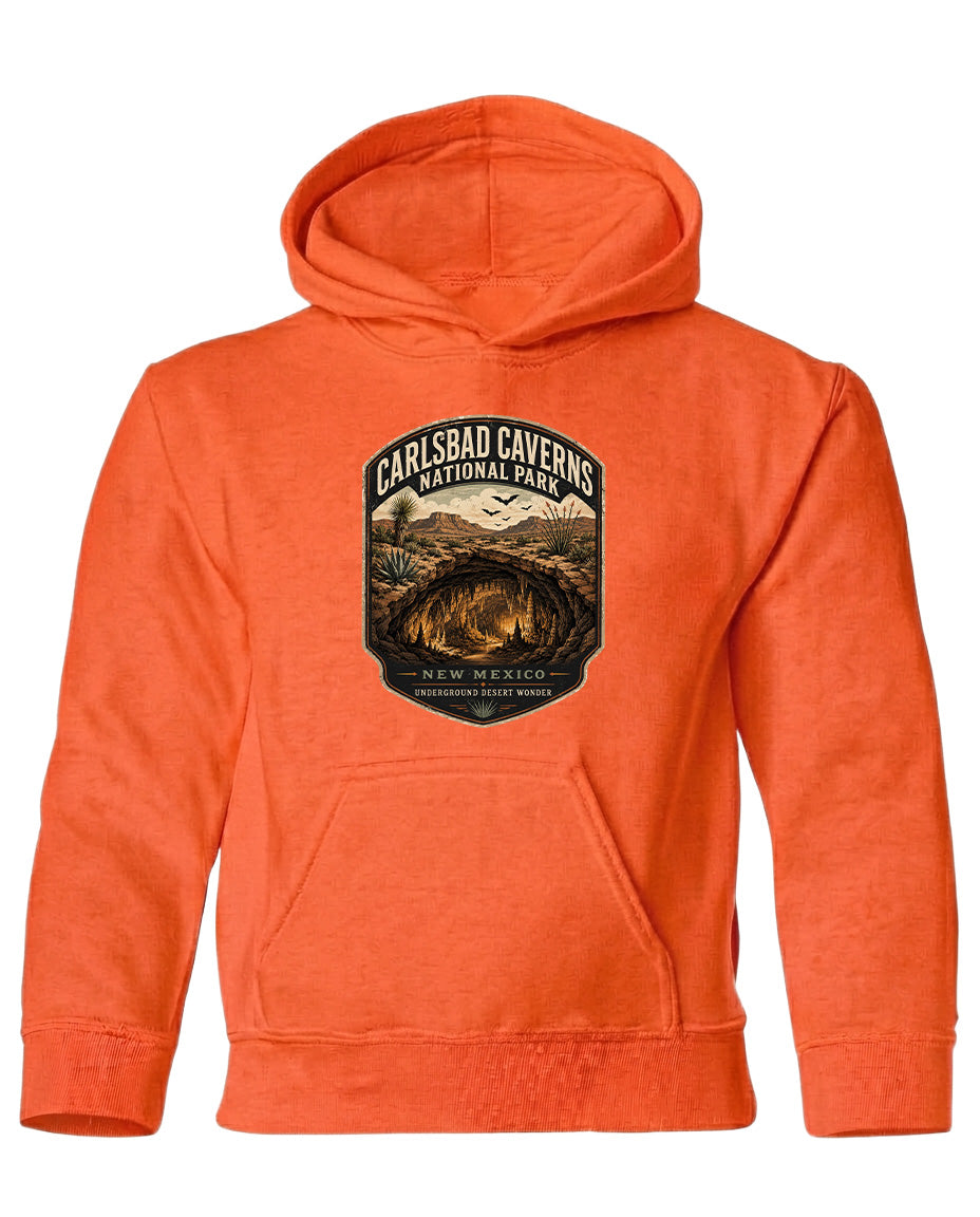 An orange hoodie with a graphic design depicting the Carlsbad Caverns National Park in New Mexico.