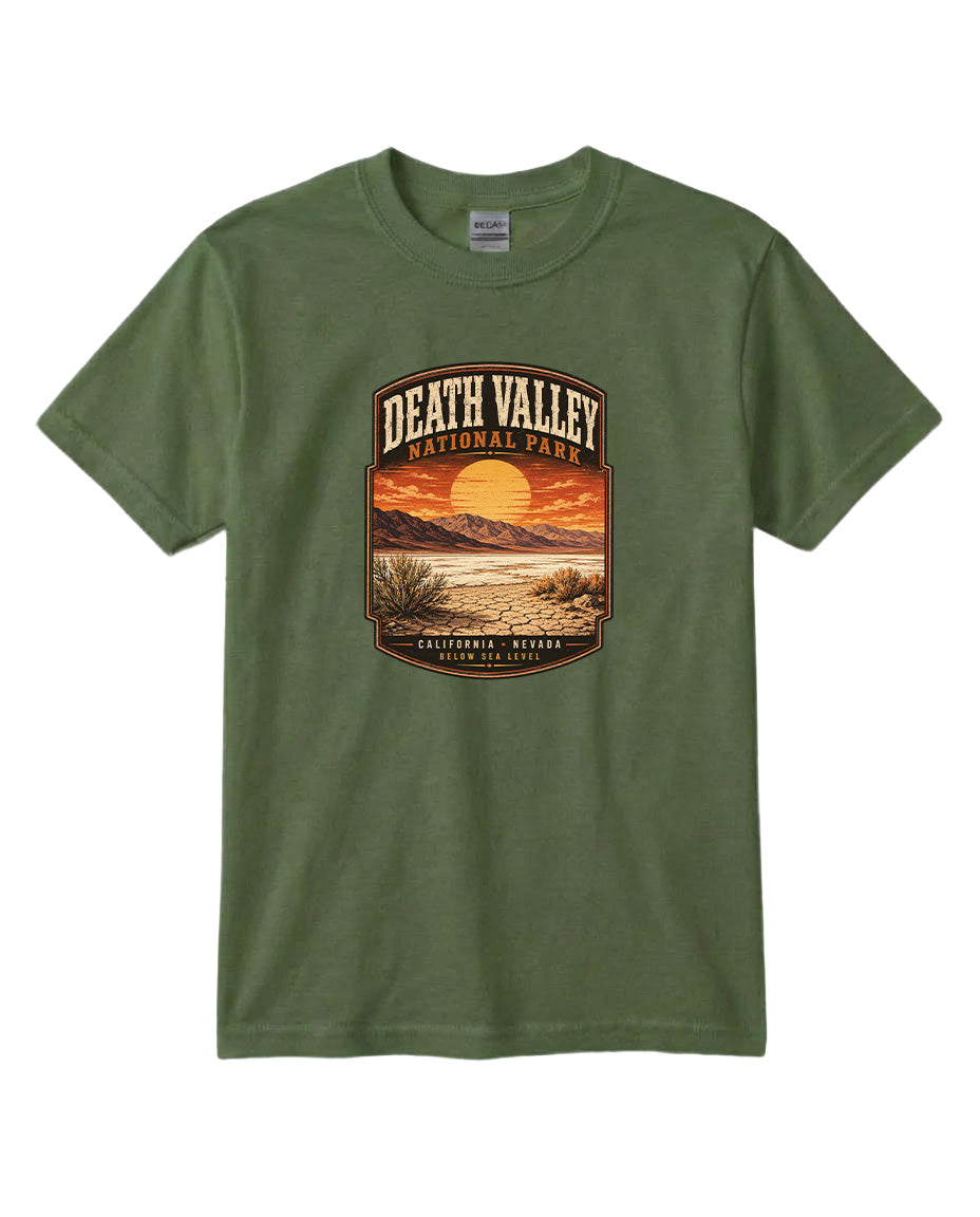 A green t-shirt with a graphic design depicting a sunset over Death Valley National Park, California, USA.