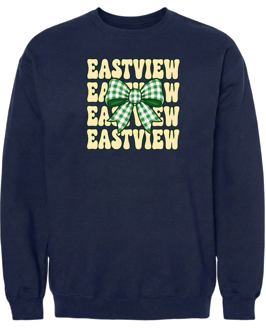 A navy blue sweatshirt with a graphic design featuring a green and white checkered bow on the front.