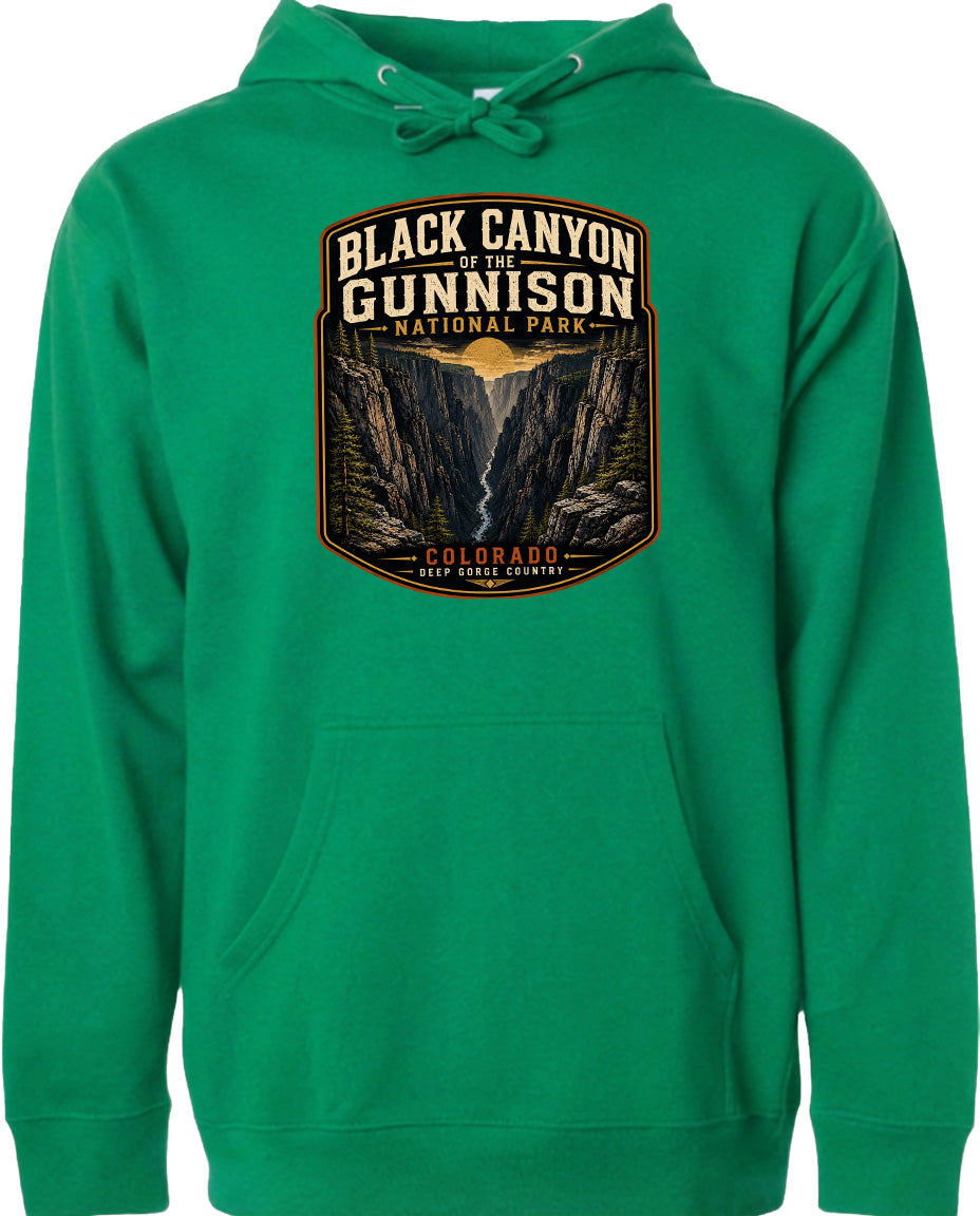 A green hoodie with a graphic design depicting the Black Canyon of the Gunnison National Park in Colorado.