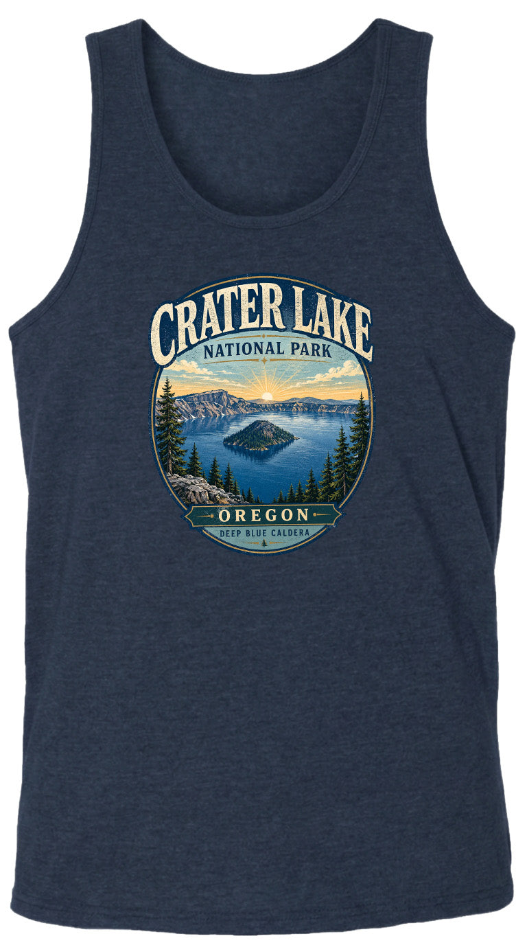 A graphic design on a dark blue tank top featuring a scenic landscape with a lake, mountains, and pine trees, along with the text "Crater Lake National Park Oregon" and "Deep Blue Caldera".