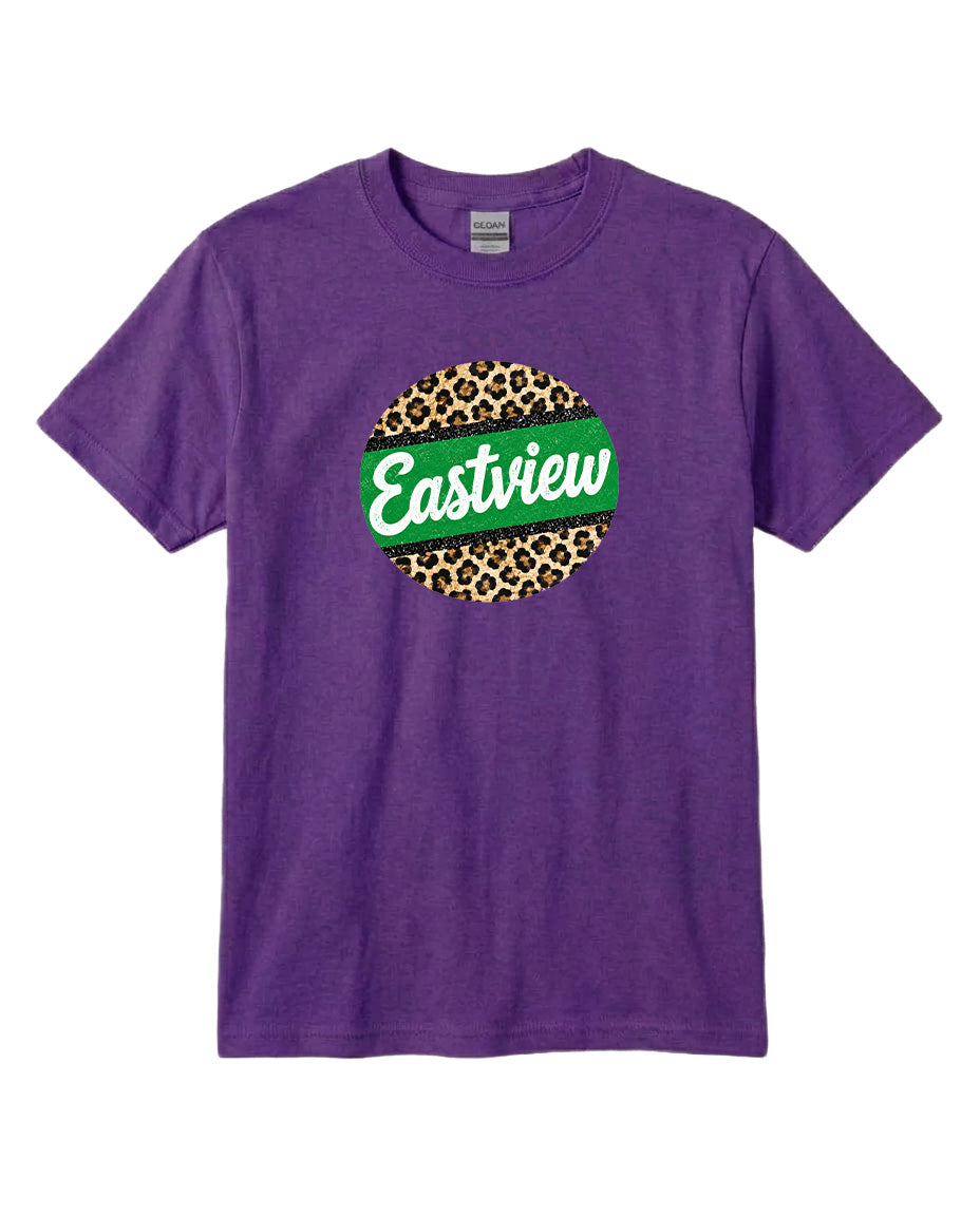 A purple t-shirt with a circular graphic design on it. The design consists of a green circle with a leopard print pattern inside it, and the word "Eastview" written in white cursive letters.
