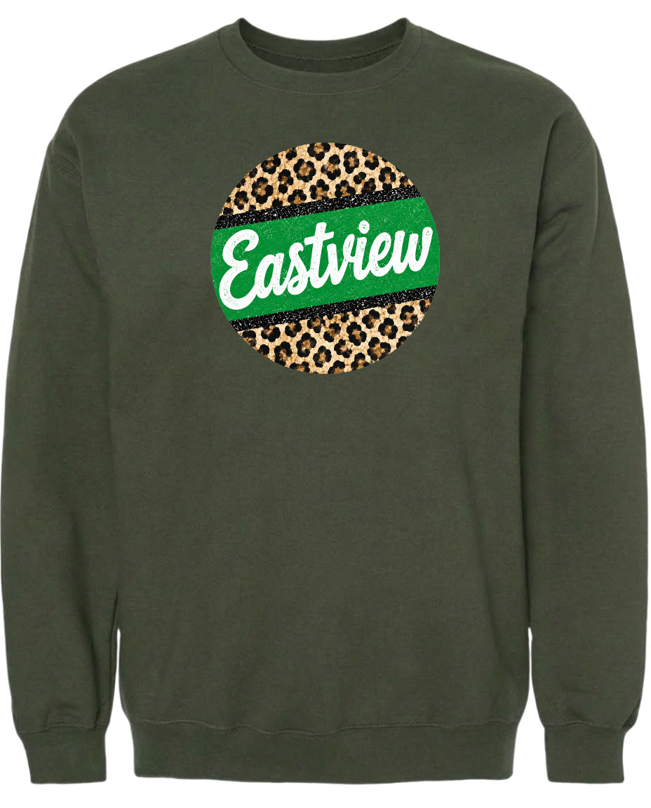 A dark green sweatshirt with a circular logo on the front. The logo features a leopard print design with a green stripe around it, and the word "Eastview" written in white cursive letters.