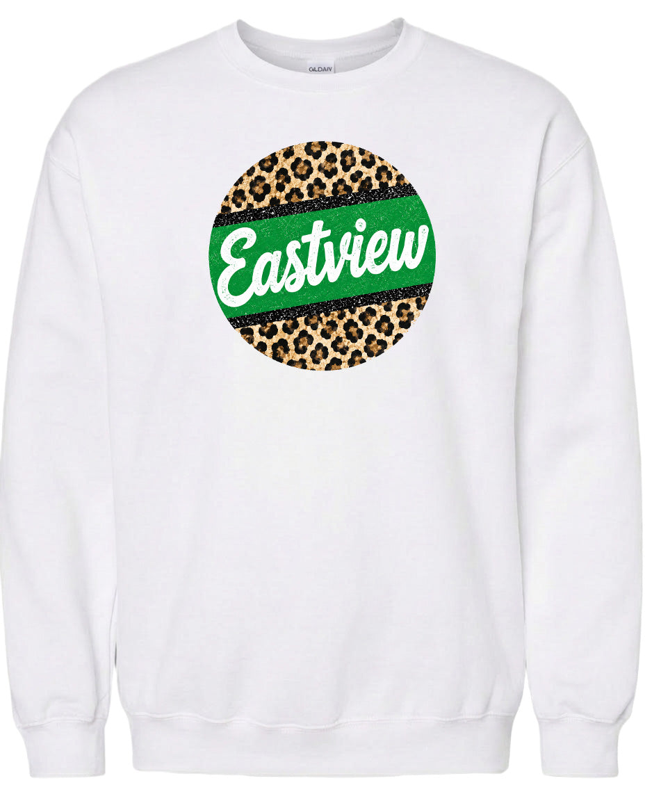 A white sweatshirt with a circular design featuring a leopard print pattern and the word "Eastview" written in green.