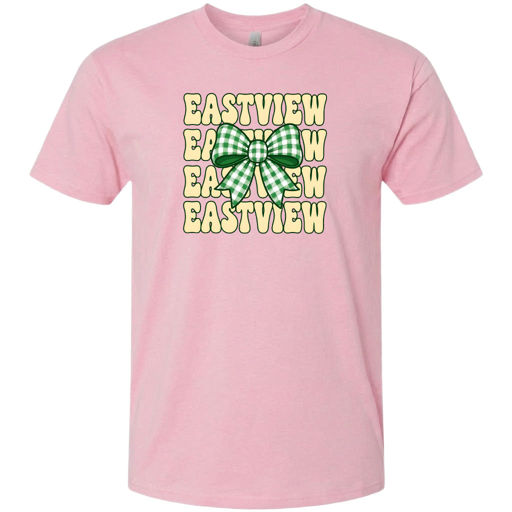 A pink t-shirt with a graphic design featuring a green and white checkered bow and the word "EASTVIEW" repeated in a vertical pattern.