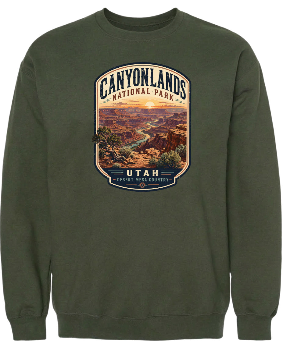 A green sweatshirt with a graphic design depicting the scenic landscape of Canyonlands National Park in Utah.