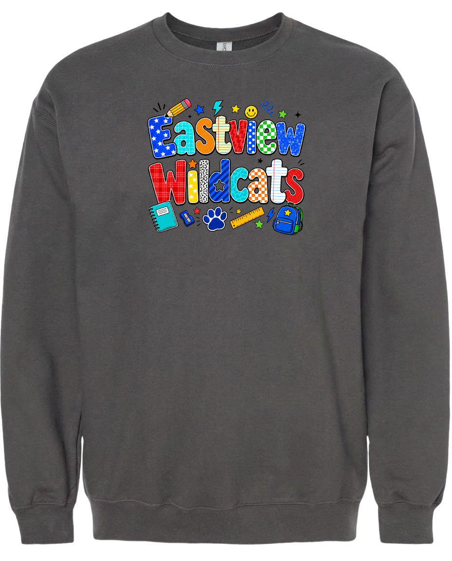 A gray sweatshirt with a colorful graphic design featuring the text "Eastview Wildcats" and various school-related icons such as a pencil, backpack, and book.