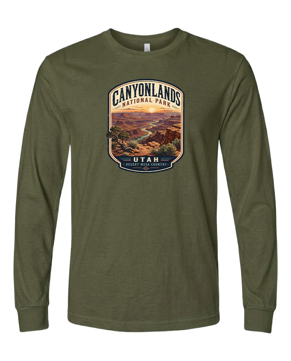 A long-sleeved olive green t-shirt with a graphic design depicting a scenic landscape of the Canyons National Park in Utah.
