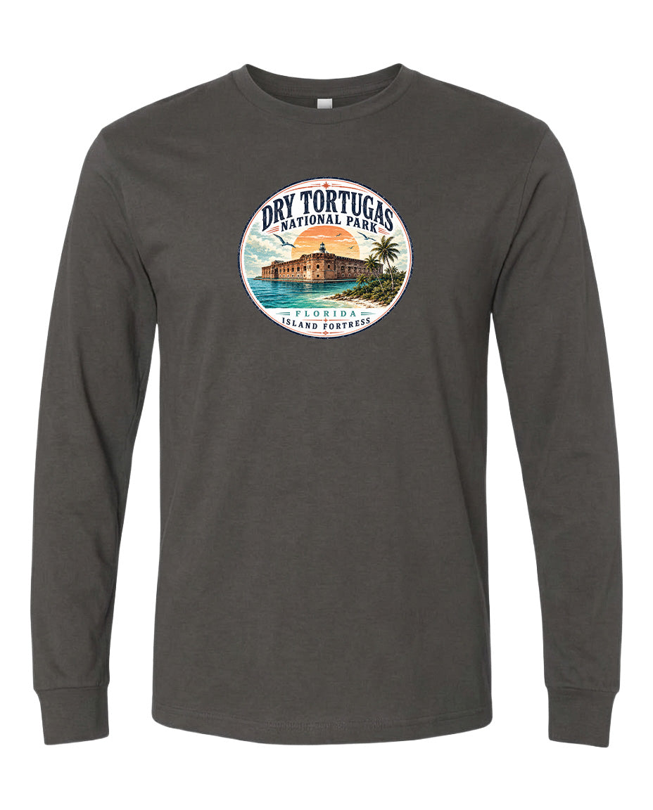 A gray long-sleeve t-shirt with a circular graphic design featuring a tropical island landscape and a building.