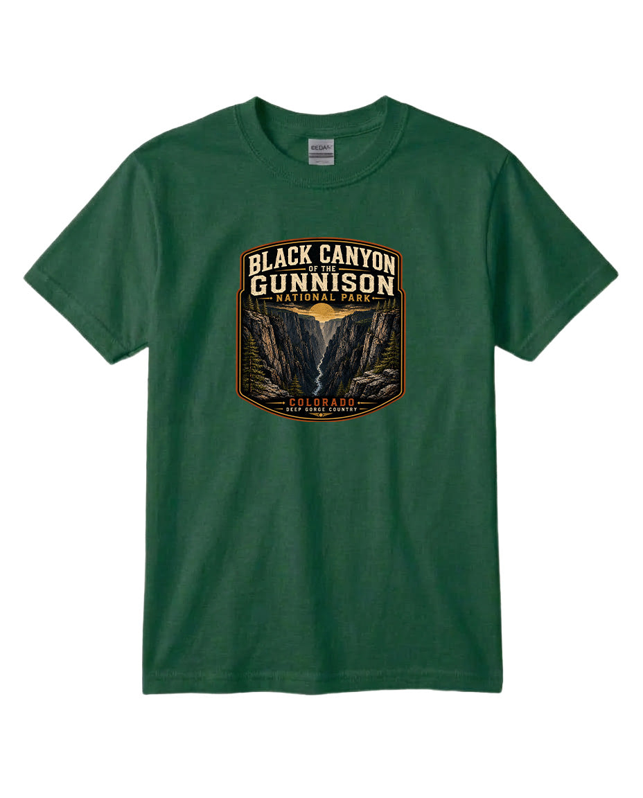 A green t-shirt with a graphic design depicting the Black Canyon of the Gunnison National Park.