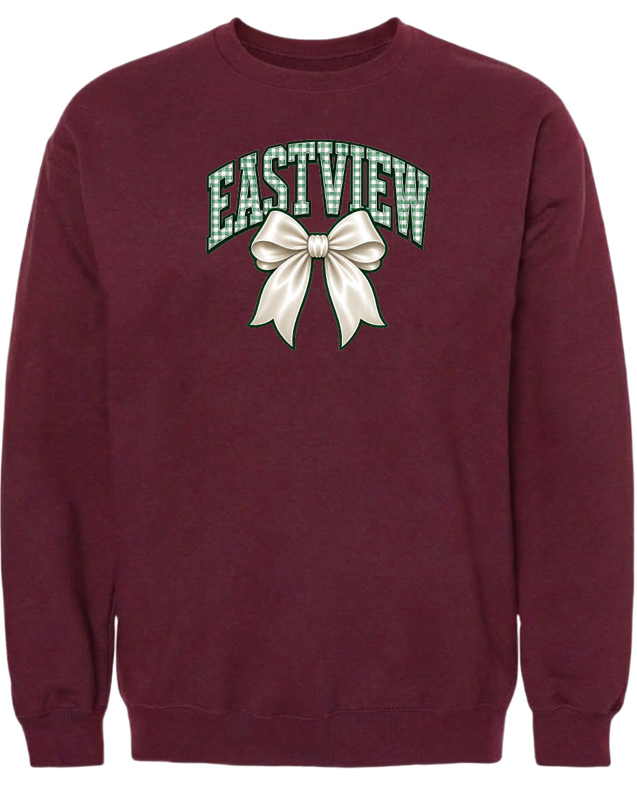 A burgundy sweatshirt with a graphic design featuring a white bow and the word "EASTVIEW" printed on it.