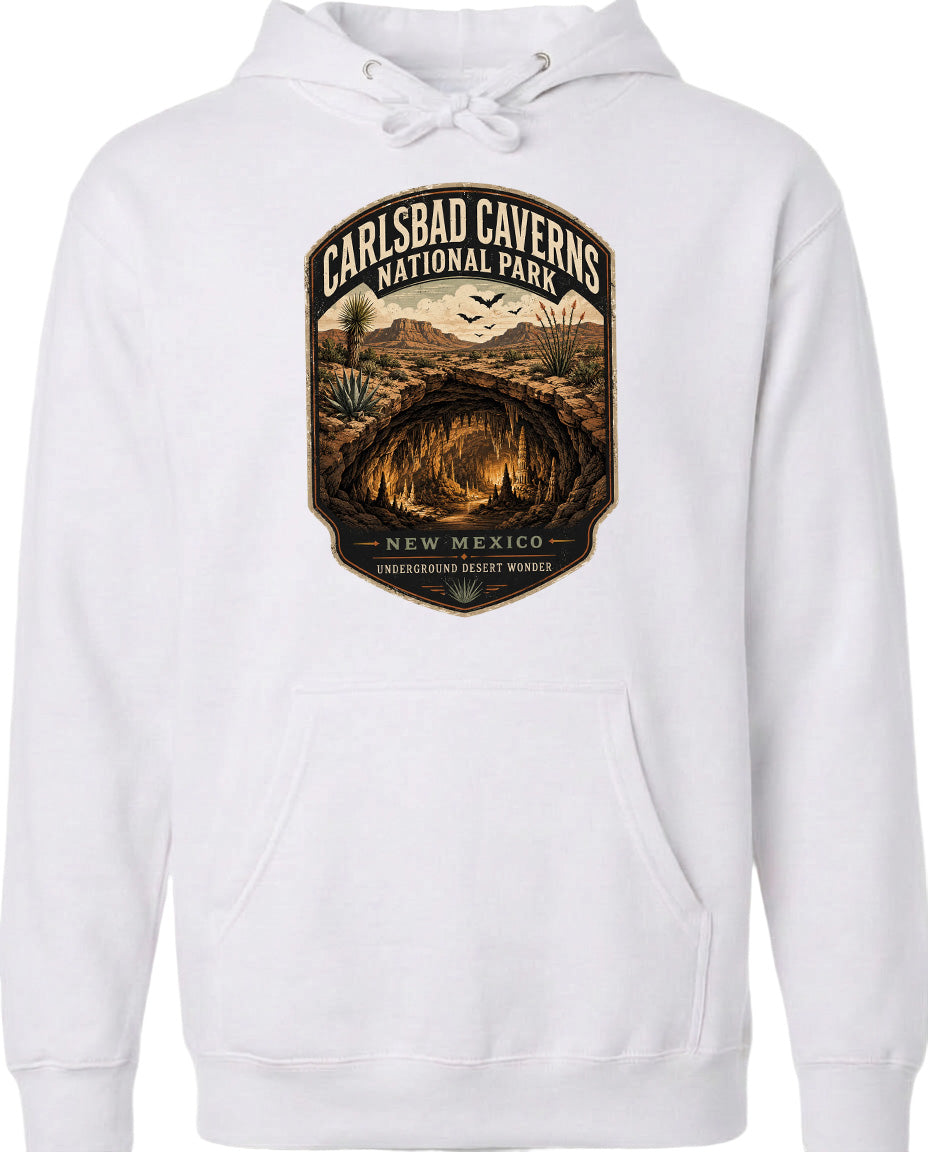 A white hoodie with a graphic design depicting the Carlsbad Caverns National Park in New Mexico.