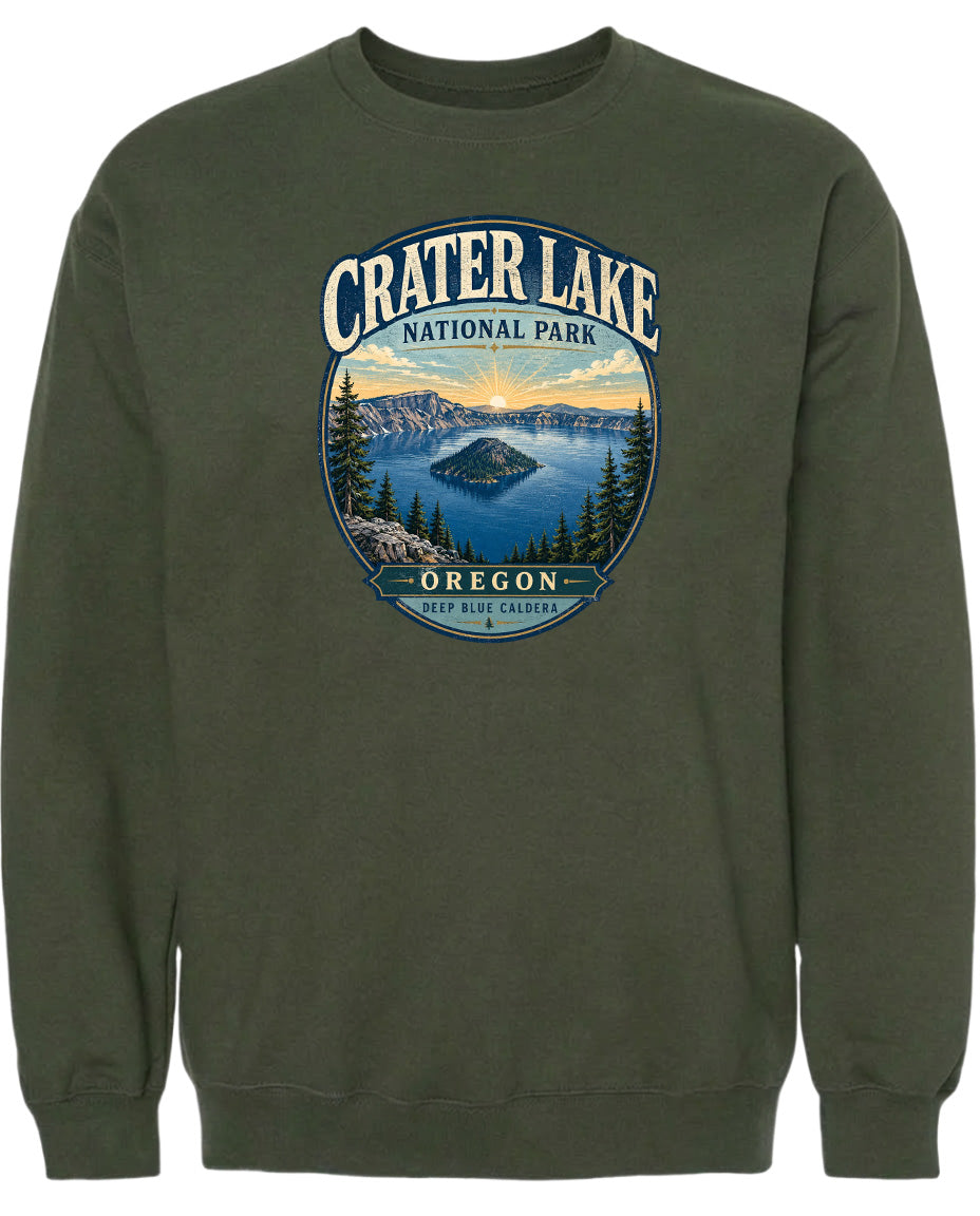 A green sweatshirt with a graphic design depicting Crater Lake National Park in Oregon.