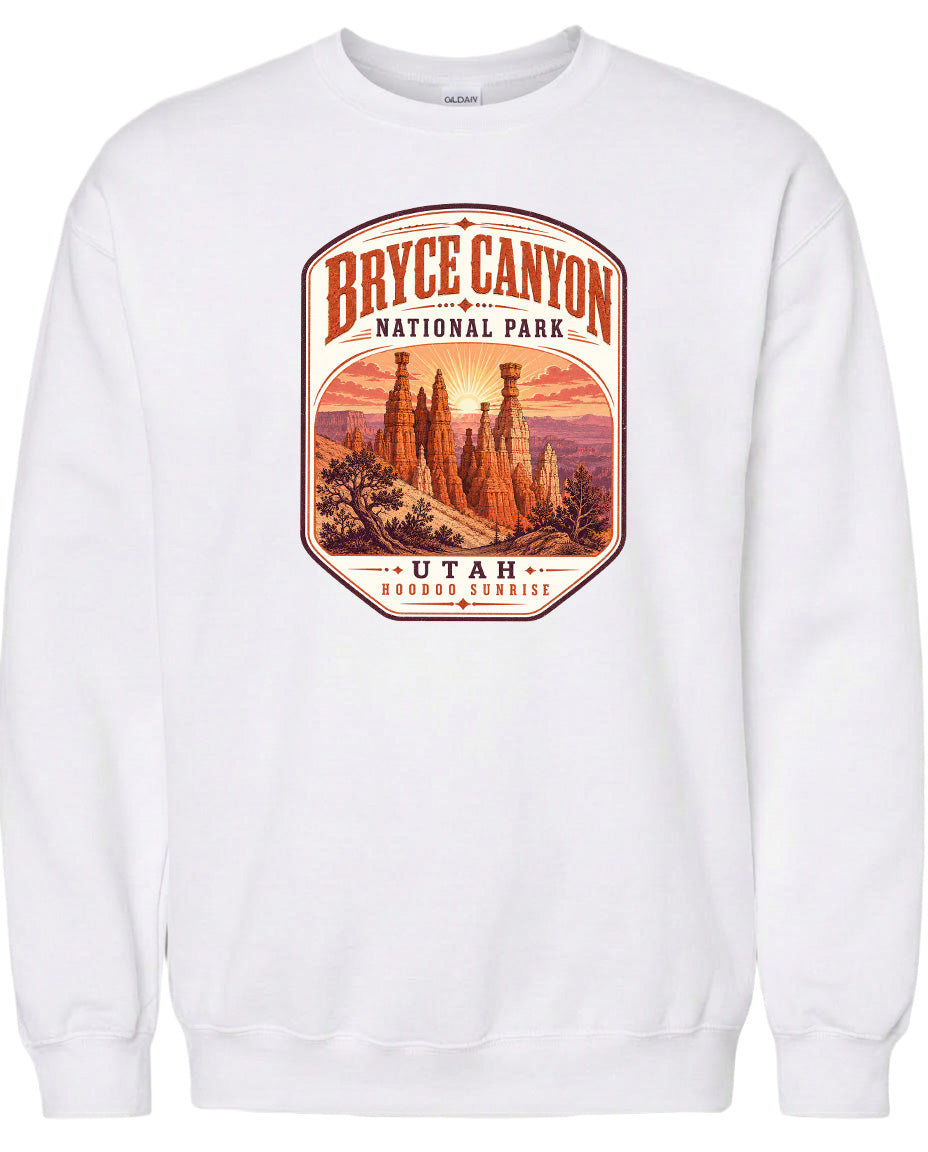 A white sweatshirt with a graphic design depicting the Bryce Canyon National Park in Utah.