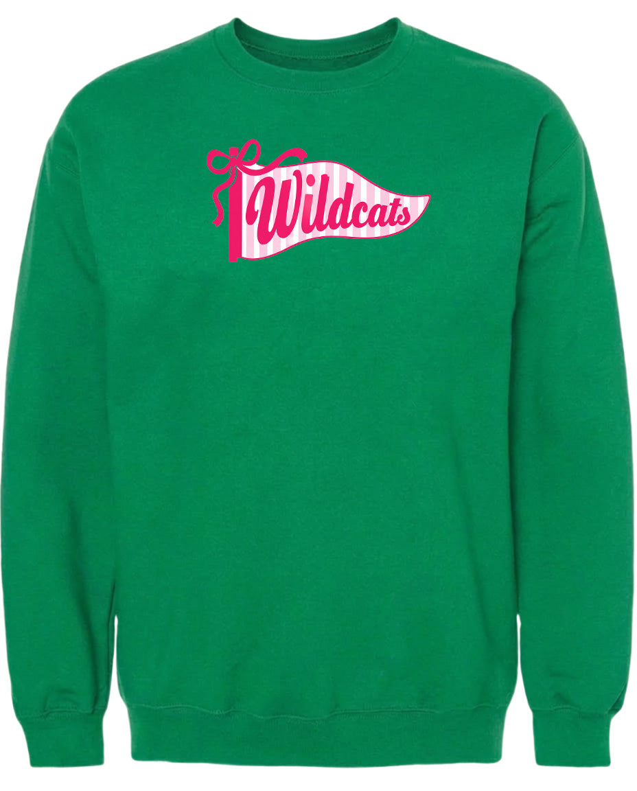 A bright green sweatshirt with a pink and white banner that says "Wildcats" on it.
