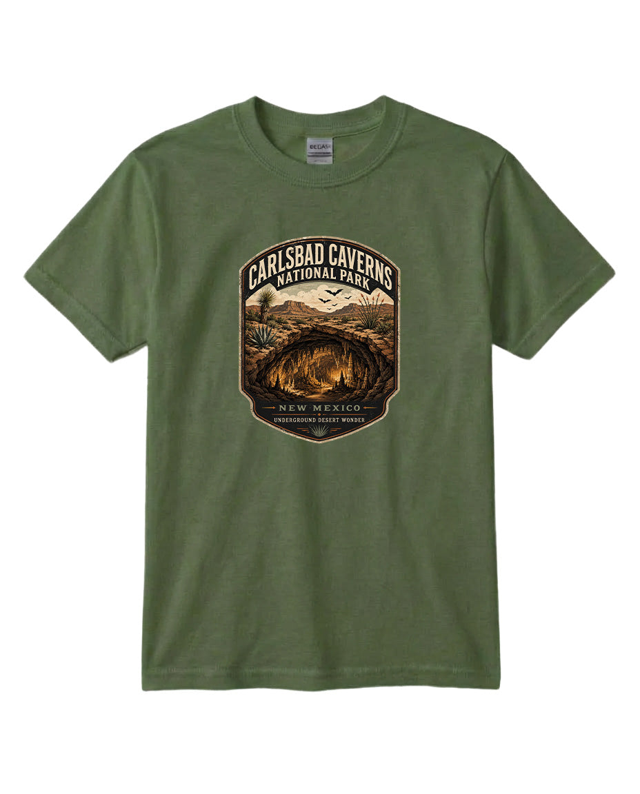 A green t-shirt with a graphic design depicting the entrance to Carlsbad Caverns National Park in New Mexico.
