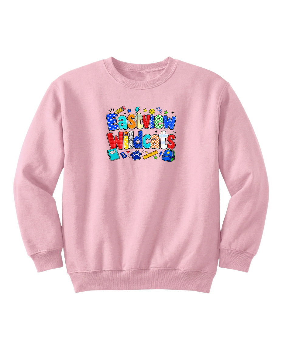 A pink sweatshirt with a colorful graphic design featuring the text "Eastview Wildcats" and various cartoon-style icons.