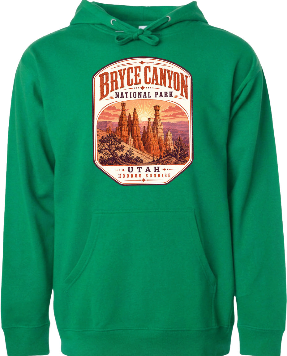 A green hoodie with a graphic design depicting Bryce Canyon National Park and Utah.