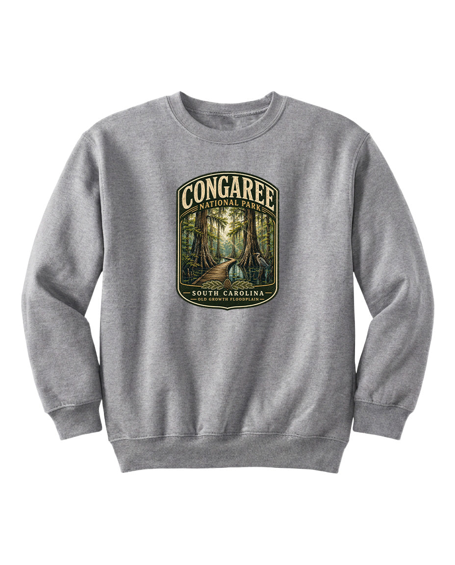 A gray sweatshirt with a graphic design depicting a forest scene and the text "CONGAREE NATIONAL PARK SOUTH CAROLINA" printed on it.